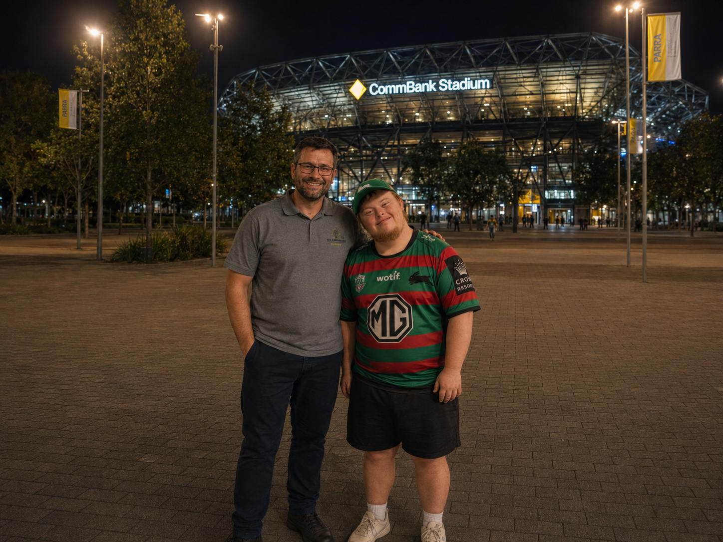 TCC support worker with participant at CommBank Stadium community outing