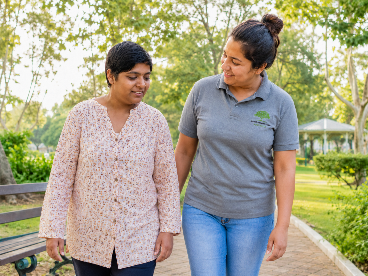TCC support worker walking with participant in the park