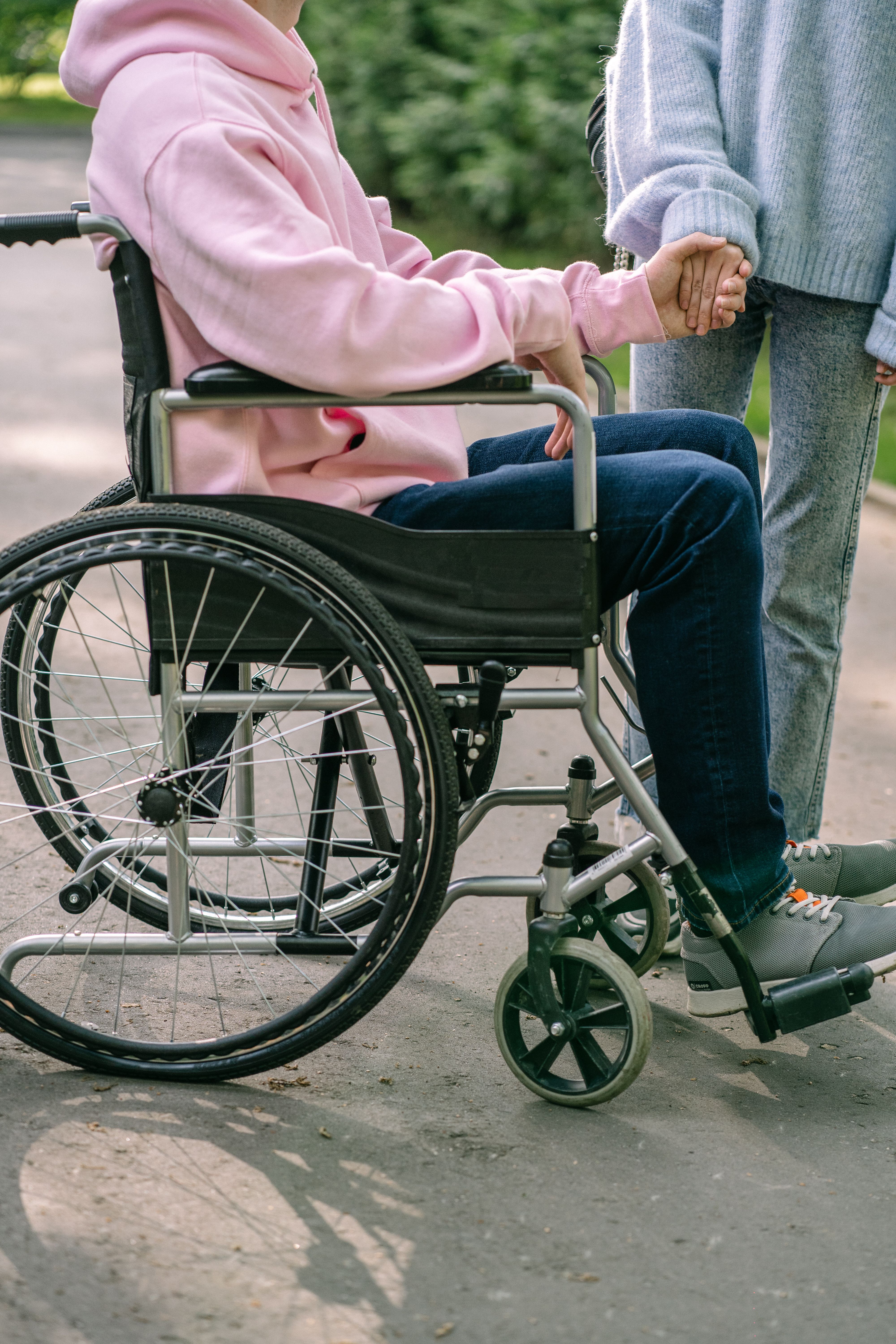 Carer assisting participant with daily living outdoors