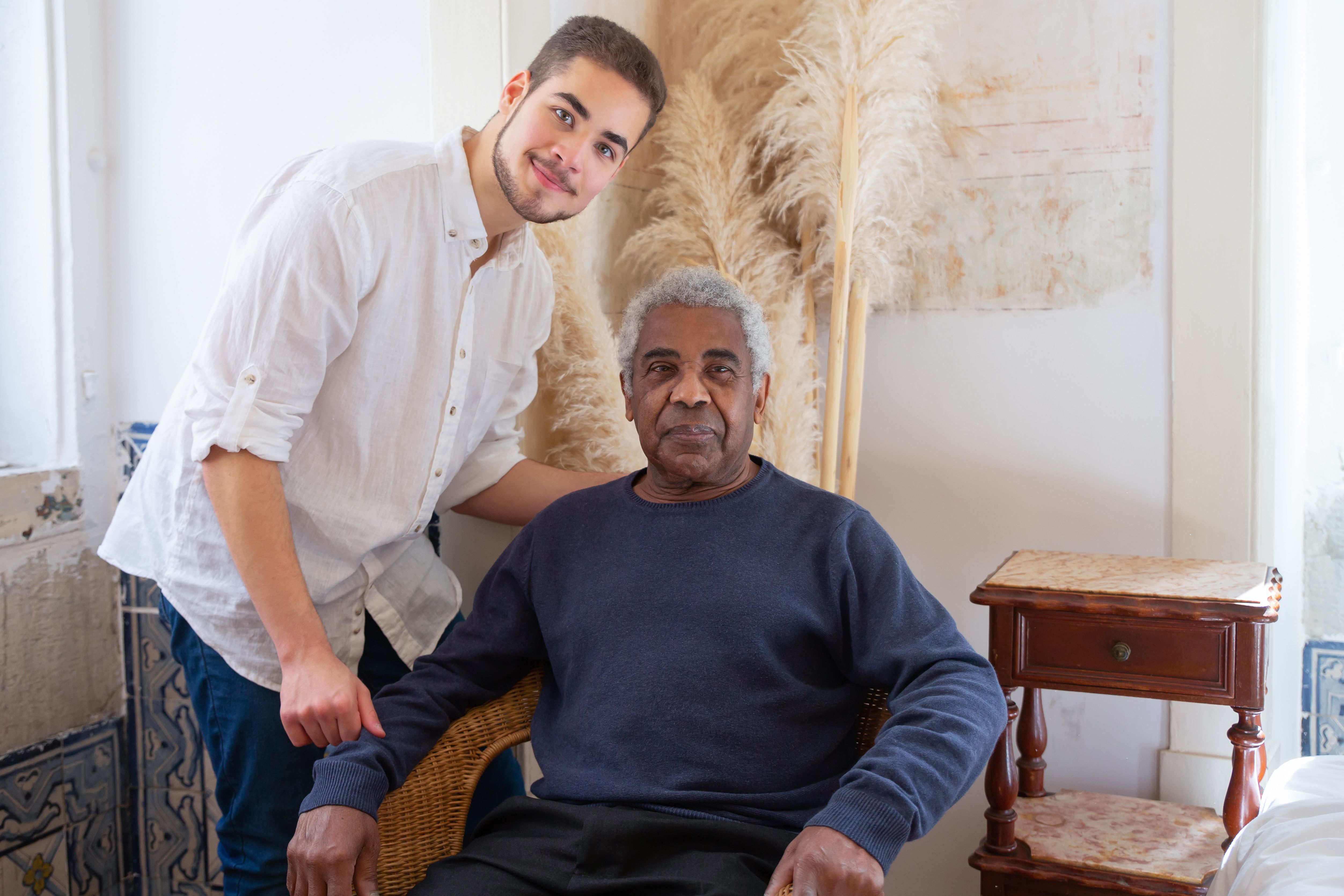 Support worker assisting participant at home